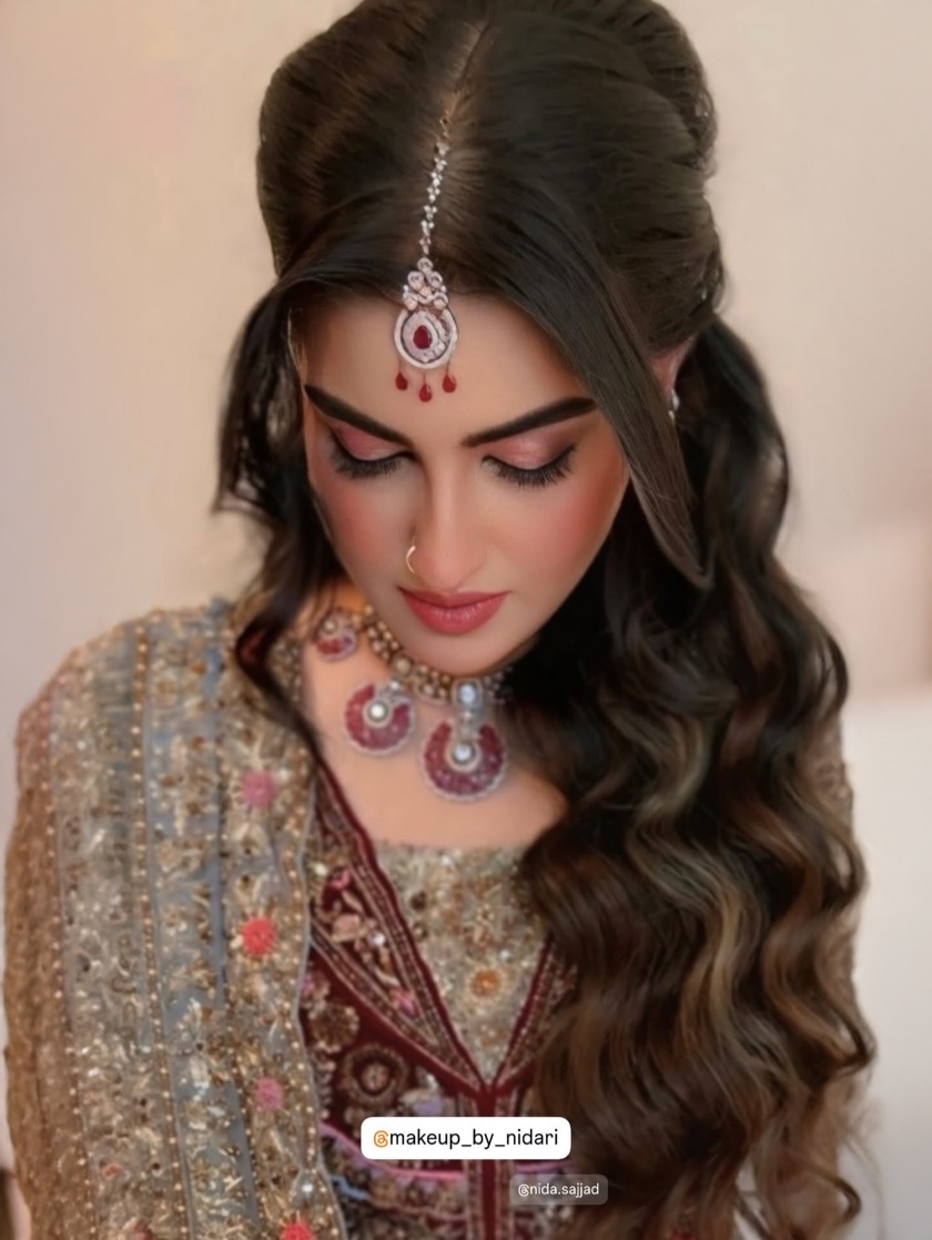 Bridal glam with maang tikka and loose waves by Makeup by Nidari, Houston