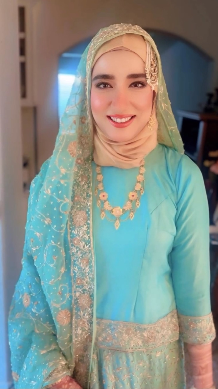 Soft bridal glam with hijab styling and gold tikka by Makeup by Nidari